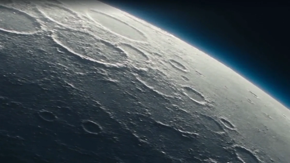Artistic lunar flyover showing cratered terrain.